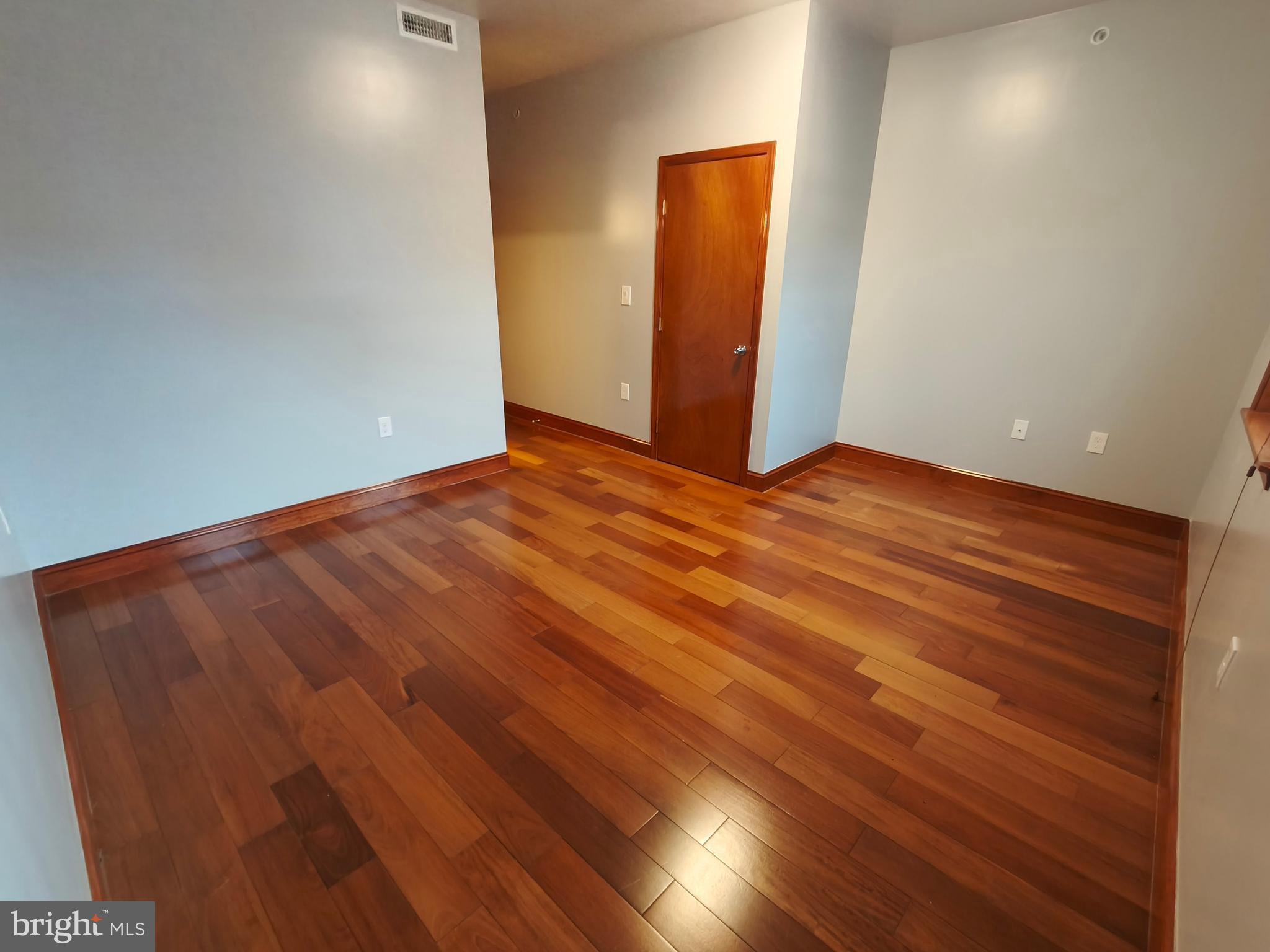 1106 Wallace Street, Unit B Philadelphia, PA 19123 - Photo 23 of 28 a view of an empty room with wooden floor