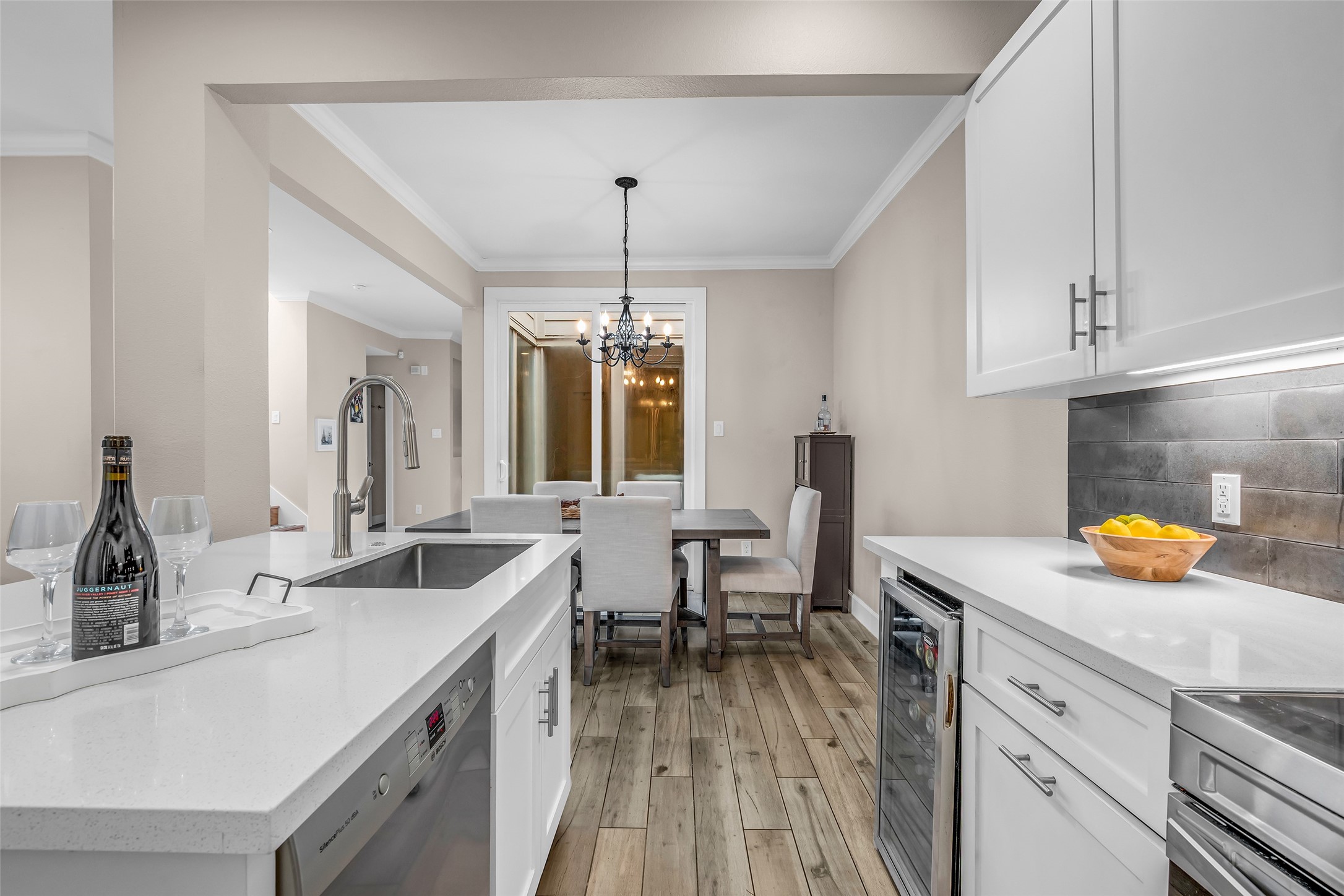 7485 Brompton Street, Unit 7485 Houston, TX 77025 - Photo 8 of 43 The adjoining dining area is conveniently located just off the kitchen, creating an effortless flow for everyday meals and entertaining while keeping family and guests connected.
