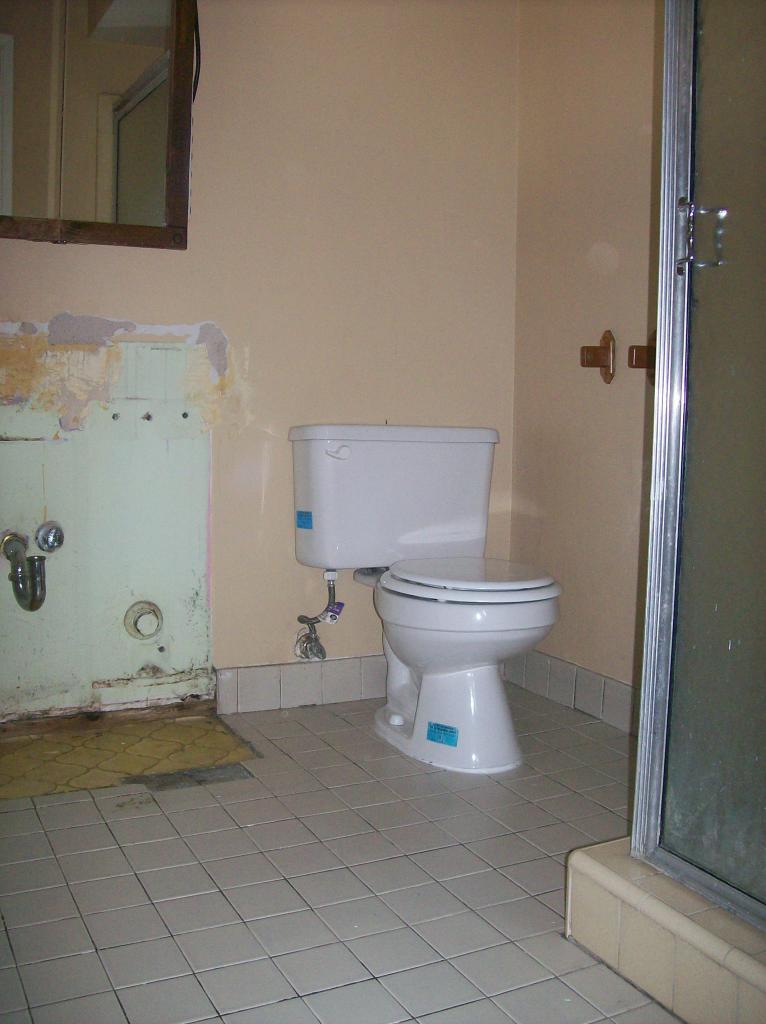 3715 West Lamar Road Phoenix, AZ 85019 - Photo 7 of 9 a bathroom with a sink and a toilet