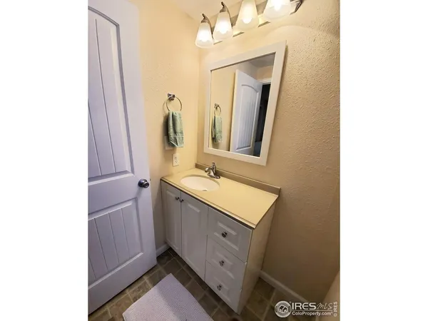 a bathroom with a double vanity sink and mirror
