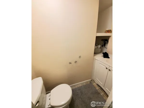 a bathroom with a toilet and a sink