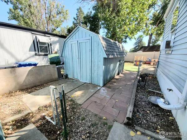 a view of a backyard with sitting area