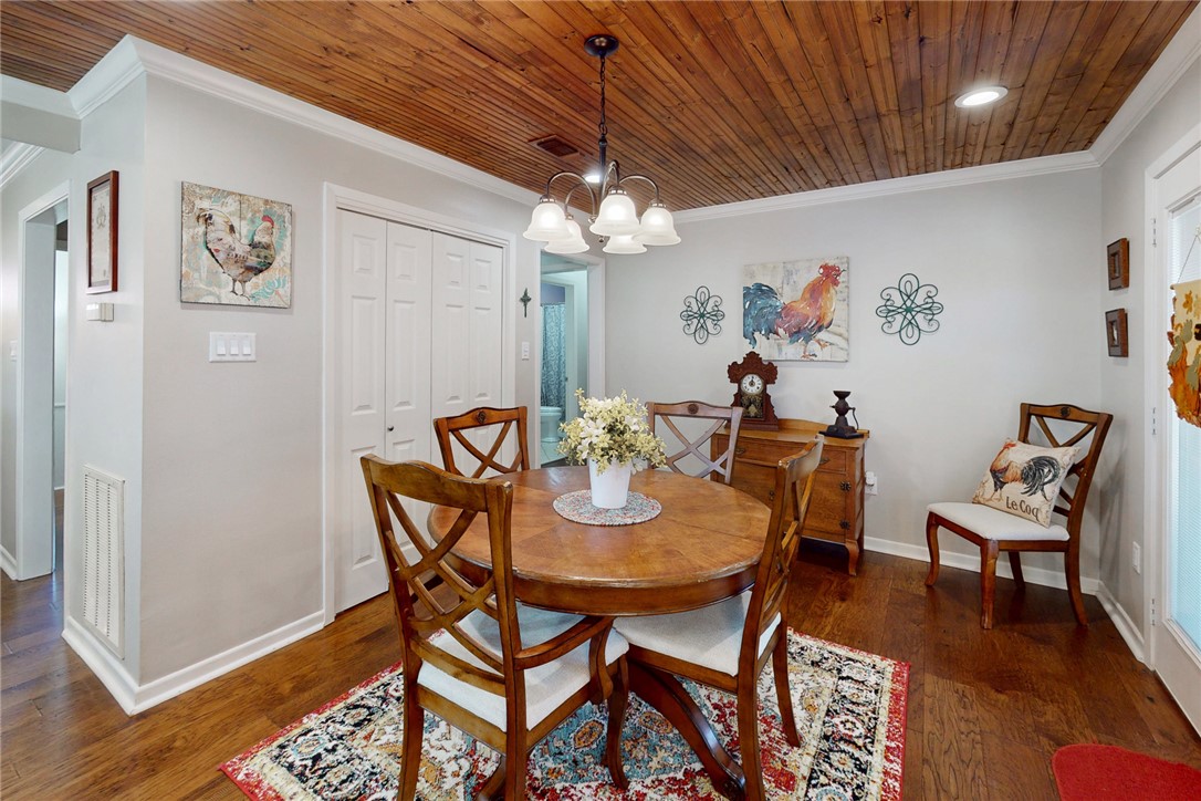 3710 Mancuso Road Bryan, TX 77808 - Photo 13 of 42 Dining space with ornamental molding, wooden ceiling, dark wood-style floors, a chandelier, and recessed lighting