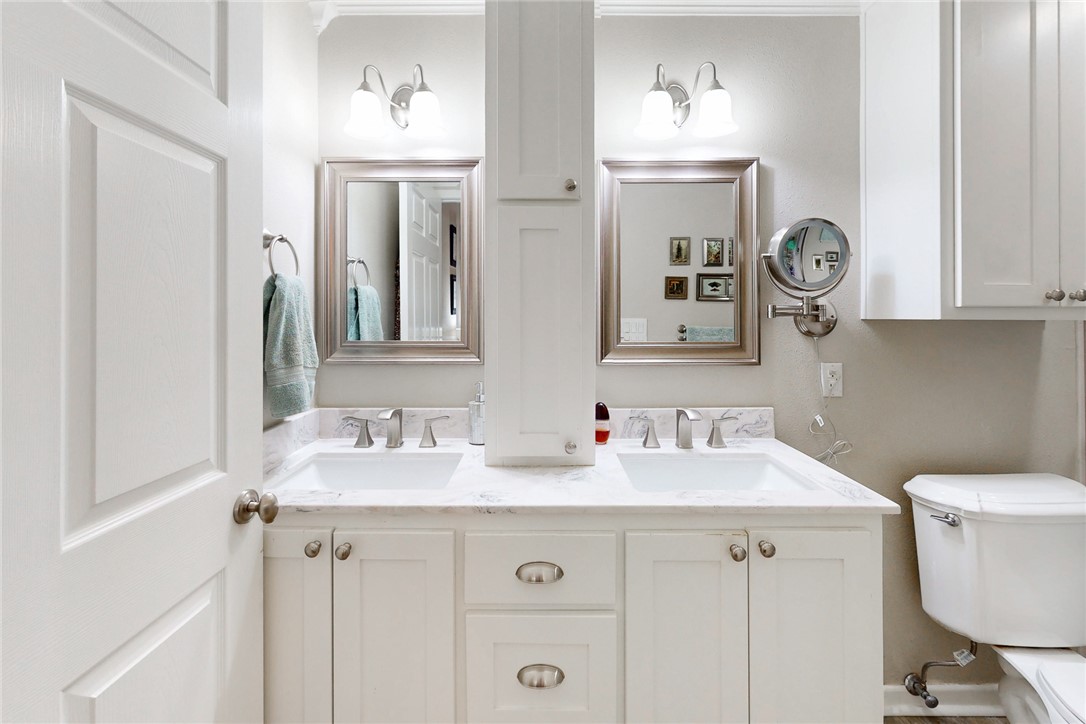 3710 Mancuso Road Bryan, TX 77808 - Photo 17 of 42 Full bathroom featuring toilet and double vanity