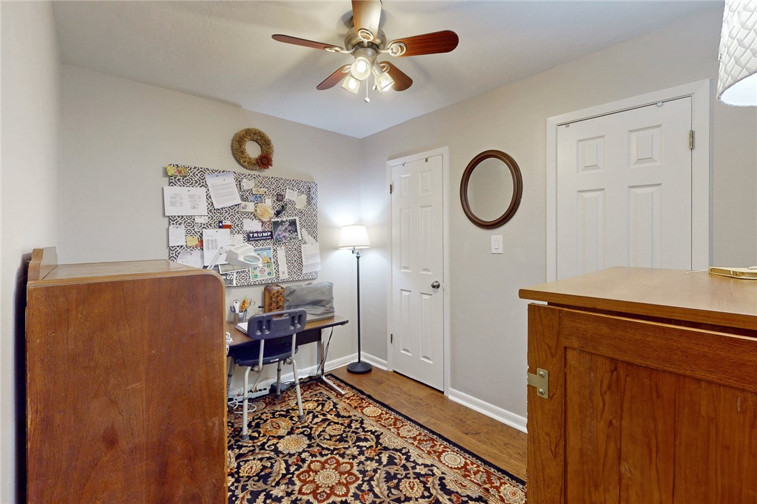 3710 Mancuso Road Bryan, TX 77808 - Photo 19 of 42 Office area featuring dark wood-style floors and a ceiling fan