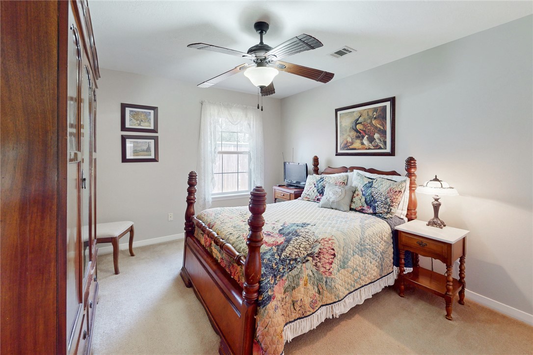 3710 Mancuso Road Bryan, TX 77808 - Photo 21 of 42 Bedroom featuring light colored carpet and a ceiling fan