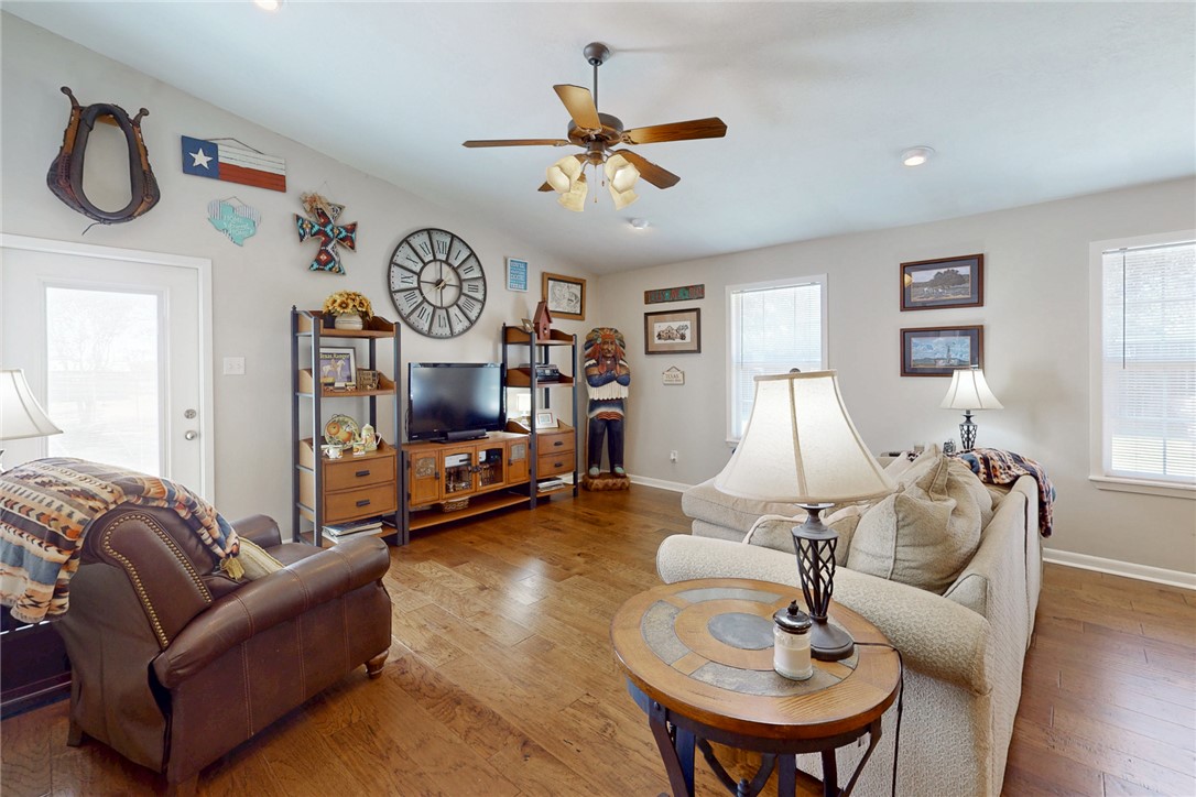 3710 Mancuso Road Bryan, TX 77808 - Photo 25 of 42 Living area with vaulted ceiling, hardwood / wood-style flooring, a ceiling fan, and recessed lighting