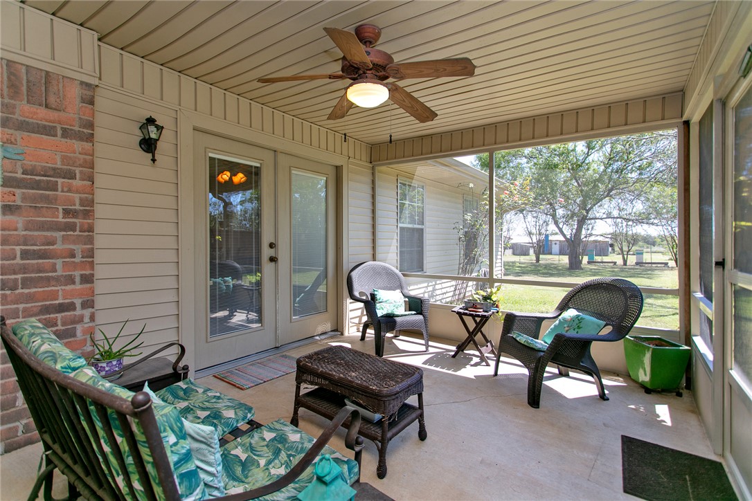 3710 Mancuso Road Bryan, TX 77808 - Photo 29 of 42 Sunroom / solarium with a ceiling fan, plenty of natural light, and french doors