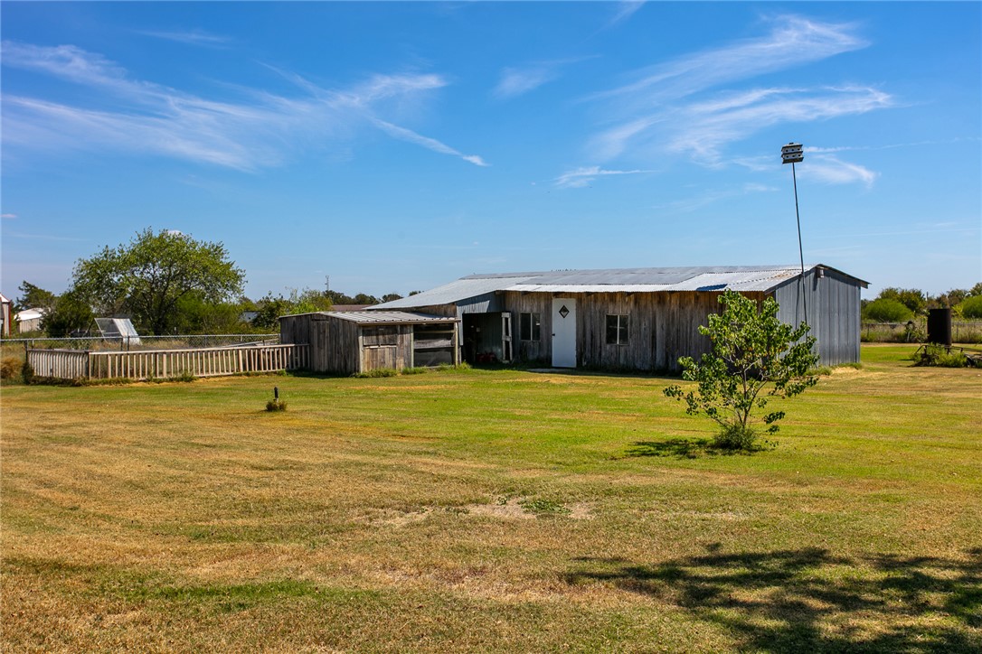 3710 Mancuso Road Bryan, TX 77808 - Photo 36 of 42 View of grassy yard featuring an outdoor structure and an outbuilding