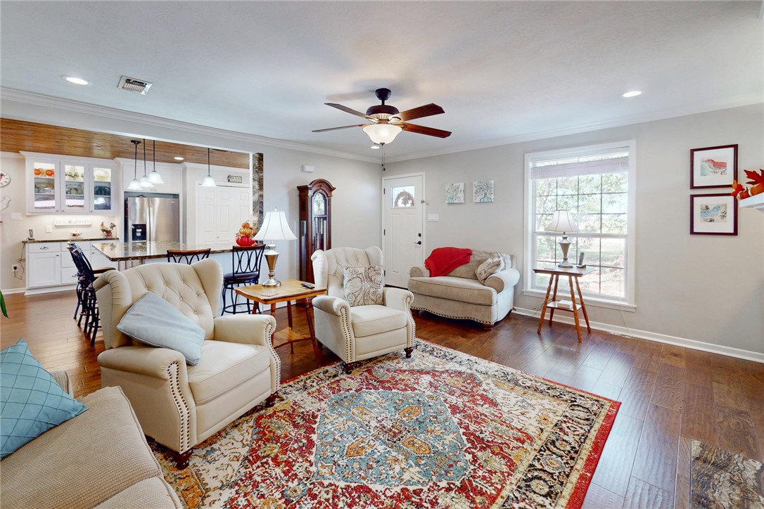 3710 Mancuso Road Bryan, TX 77808 - Photo 7 of 42 Living room featuring ornamental molding, ceiling fan, dark wood finished floors, and recessed lighting