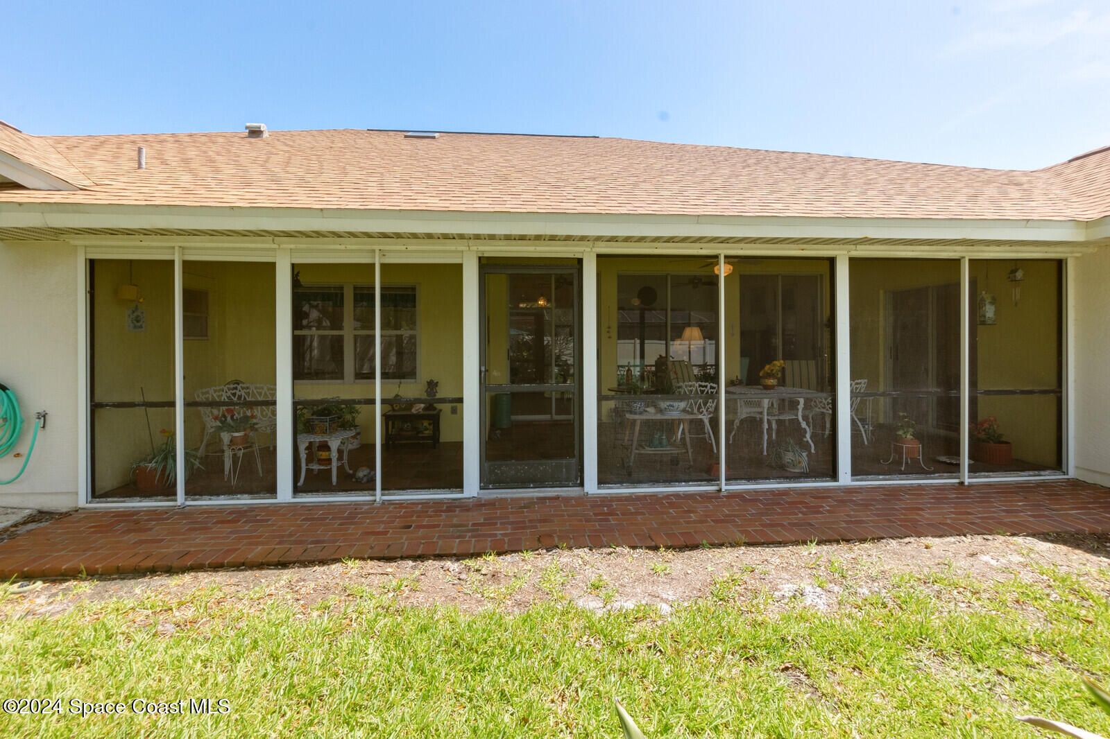410 Oriole Lane Indialantic, FL 32903 - Photo 13 of 92 a view of a house with a floor to ceiling windows