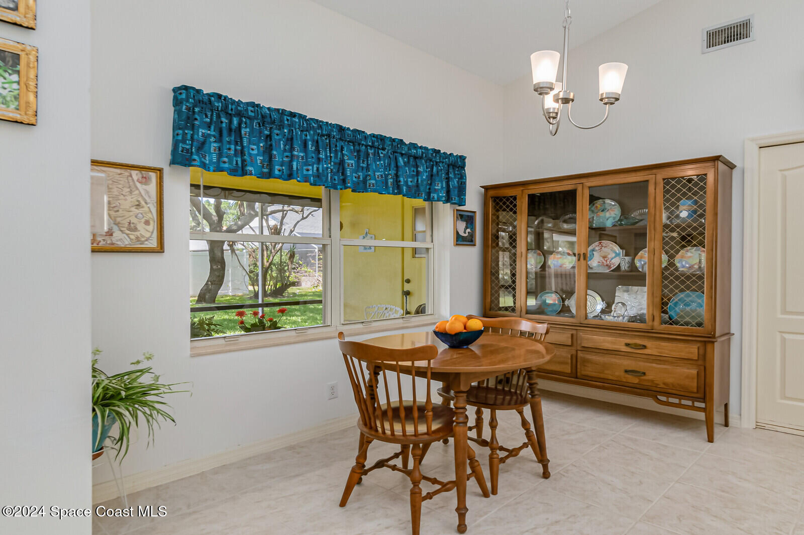 410 Oriole Lane Indialantic, FL 32903 - Photo 27 of 92 a dining room with furniture and window