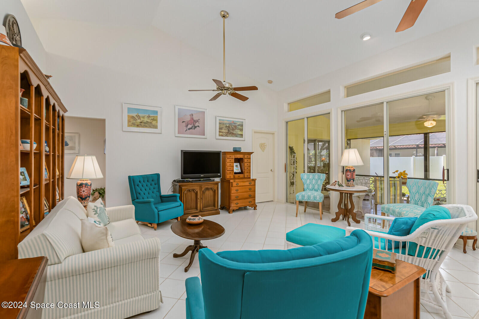 410 Oriole Lane Indialantic, FL 32903 - Photo 29 of 92 a living room with furniture a flat screen tv and a large window