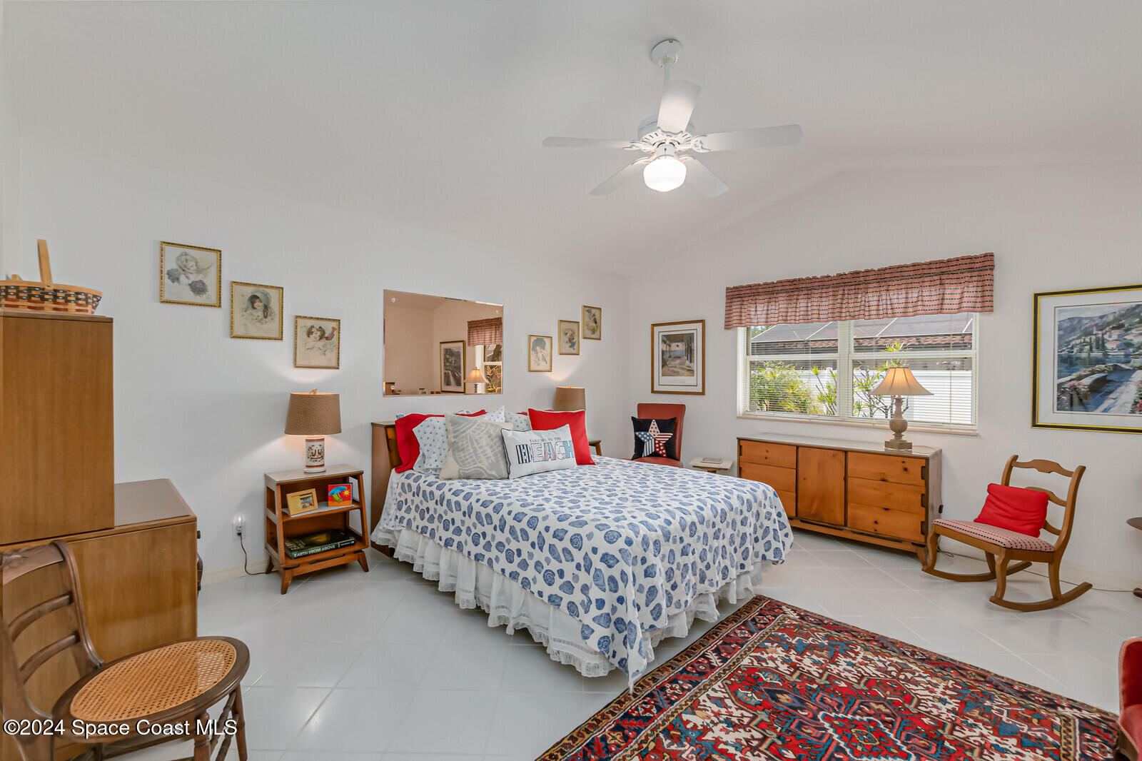 410 Oriole Lane Indialantic, FL 32903 - Photo 33 of 92 a bedroom with a bed and a chandelier