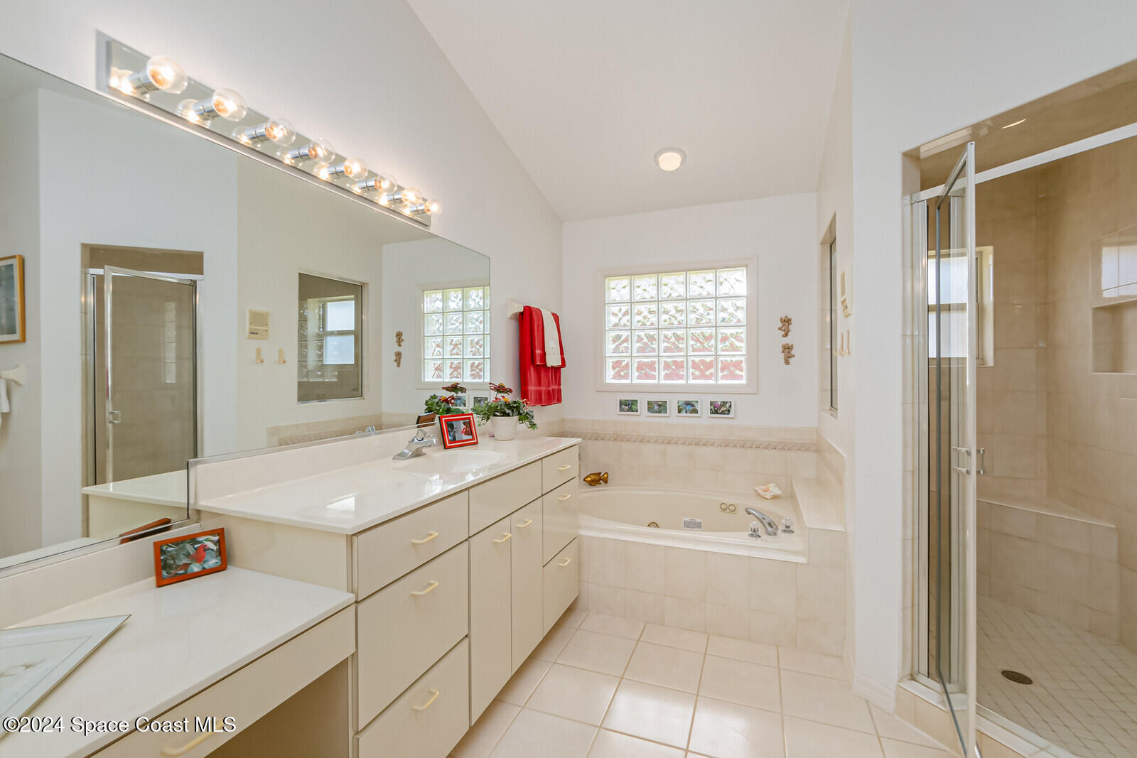 410 Oriole Lane Indialantic, FL 32903 - Photo 35 of 92 a bathroom with a tub sink and mirror