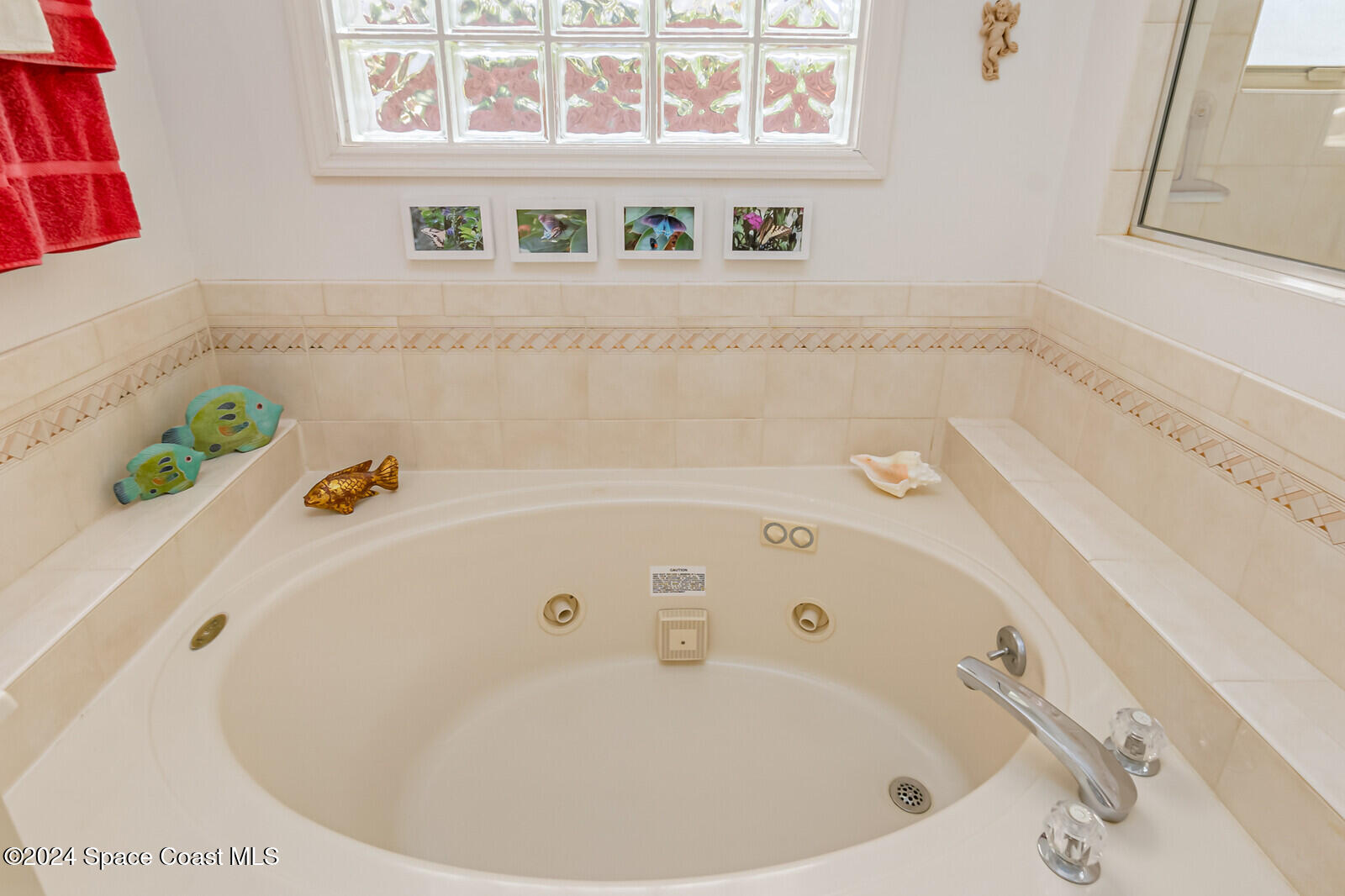 410 Oriole Lane Indialantic, FL 32903 - Photo 37 of 92 a bathroom with a tub a sink and wooden floor