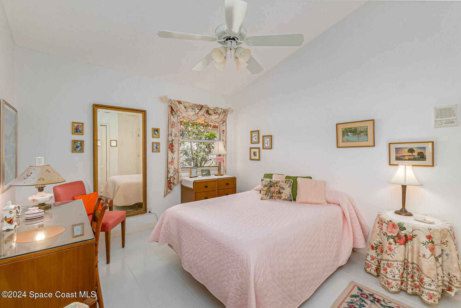 410 Oriole Lane Indialantic, FL 32903 - Photo 39 of 92 a bedroom with a bed and a chandelier