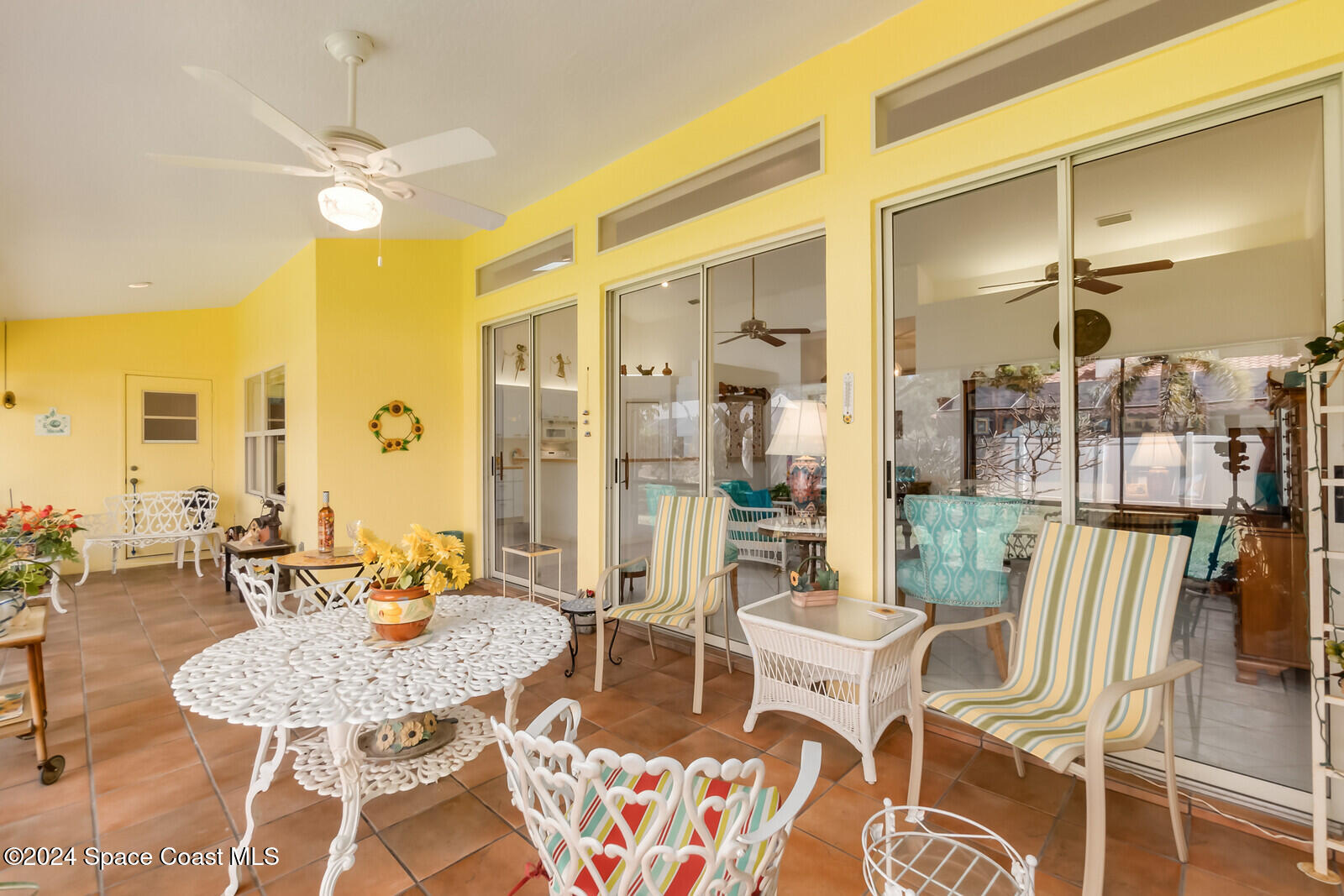 410 Oriole Lane Indialantic, FL 32903 - Photo 47 of 92 a dining room with furniture and a chandelier