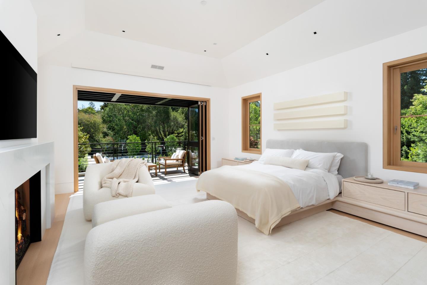 233 Park Lane Atherton, CA 94027 - Photo 11 of 26 a large white bed sitting in a bedroom next to a window with a flat screen tv