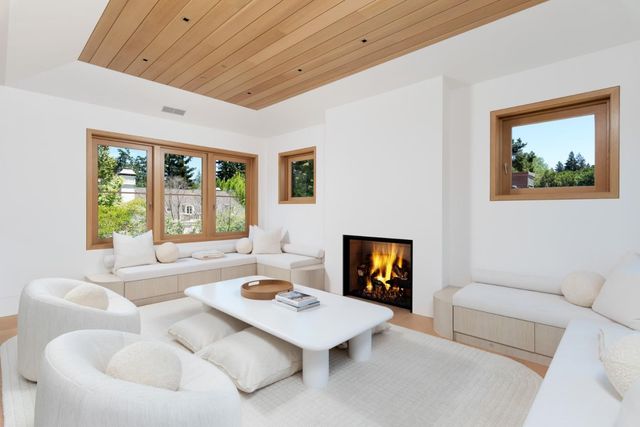a view of living room with furniture and a large window