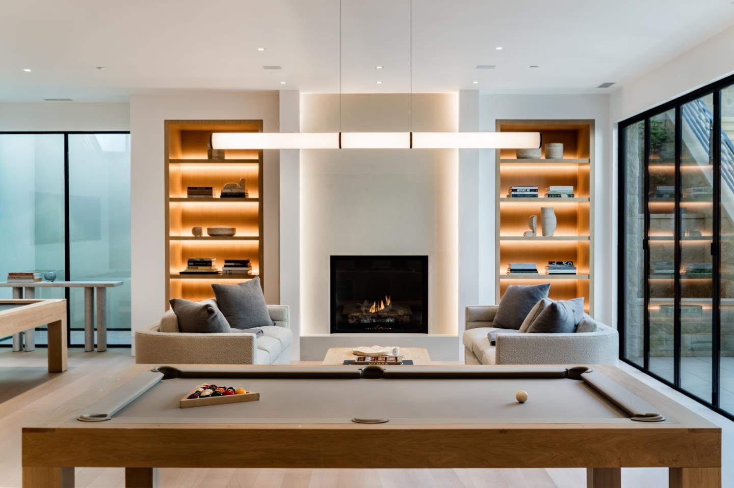 233 Park Lane Atherton, CA 94027 - Photo 17 of 26 a living room with a couch a table and a fireplace