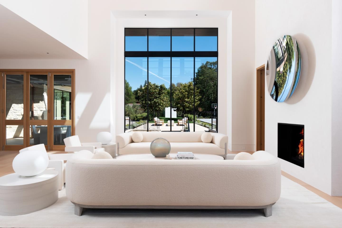 233 Park Lane Atherton, CA 94027 - Photo 4 of 26 a living room with furniture a fireplace and a floor to ceiling window