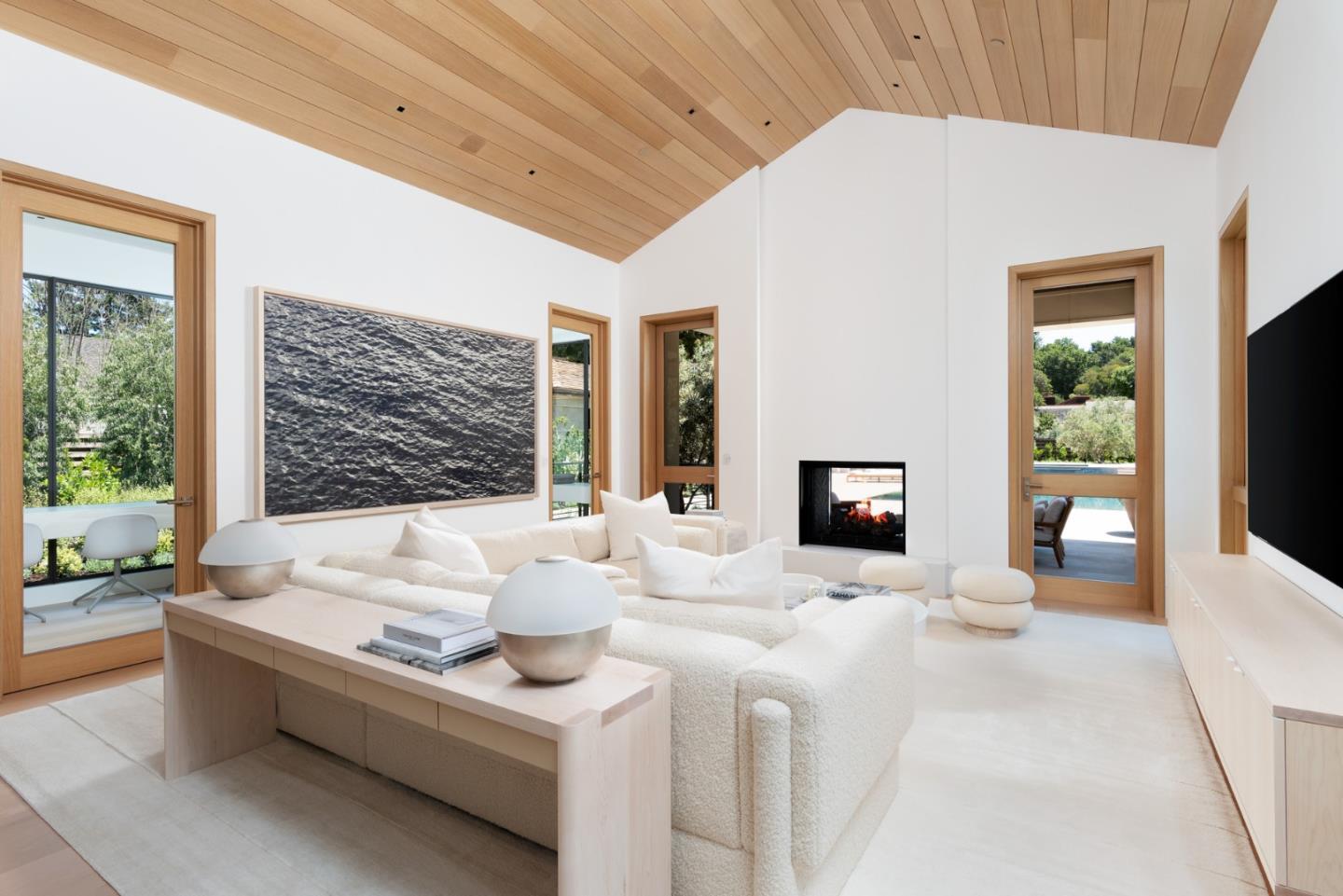 233 Park Lane Atherton, CA 94027 - Photo 5 of 26 a living room with fireplace furniture and a flat screen tv