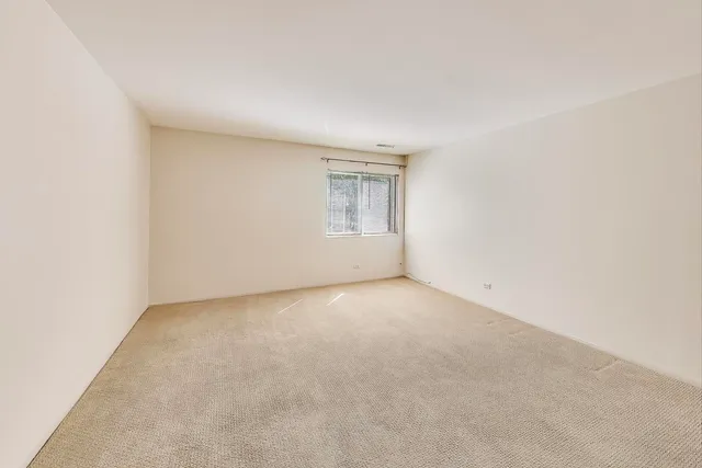 a bathroom with a sink vanity mirror and toilet