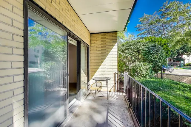 a balcony with view of an outdoor space