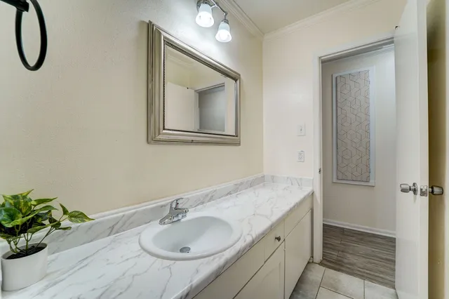 a bathroom with a sink and a mirror