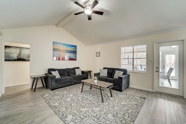 a living room with furniture and a window