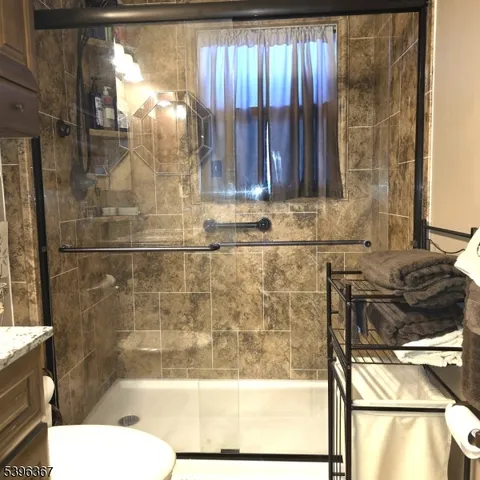 a bathroom with a bathtub and shower