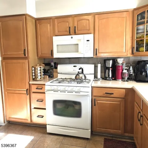 a kitchen with appliances cabinets and a sink