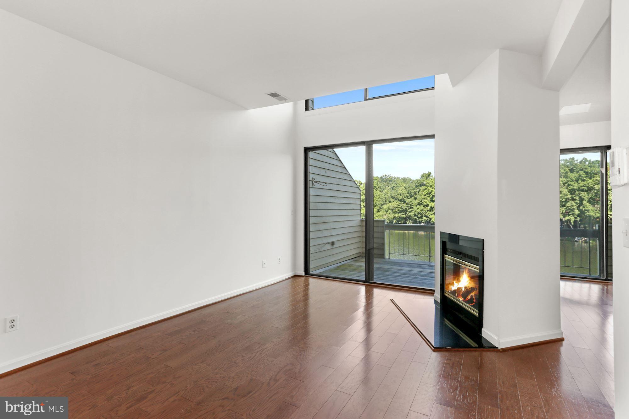 11266 Harbor Court Reston, VA 20191 - Photo 4 of 31 Living room - great views & fireplace