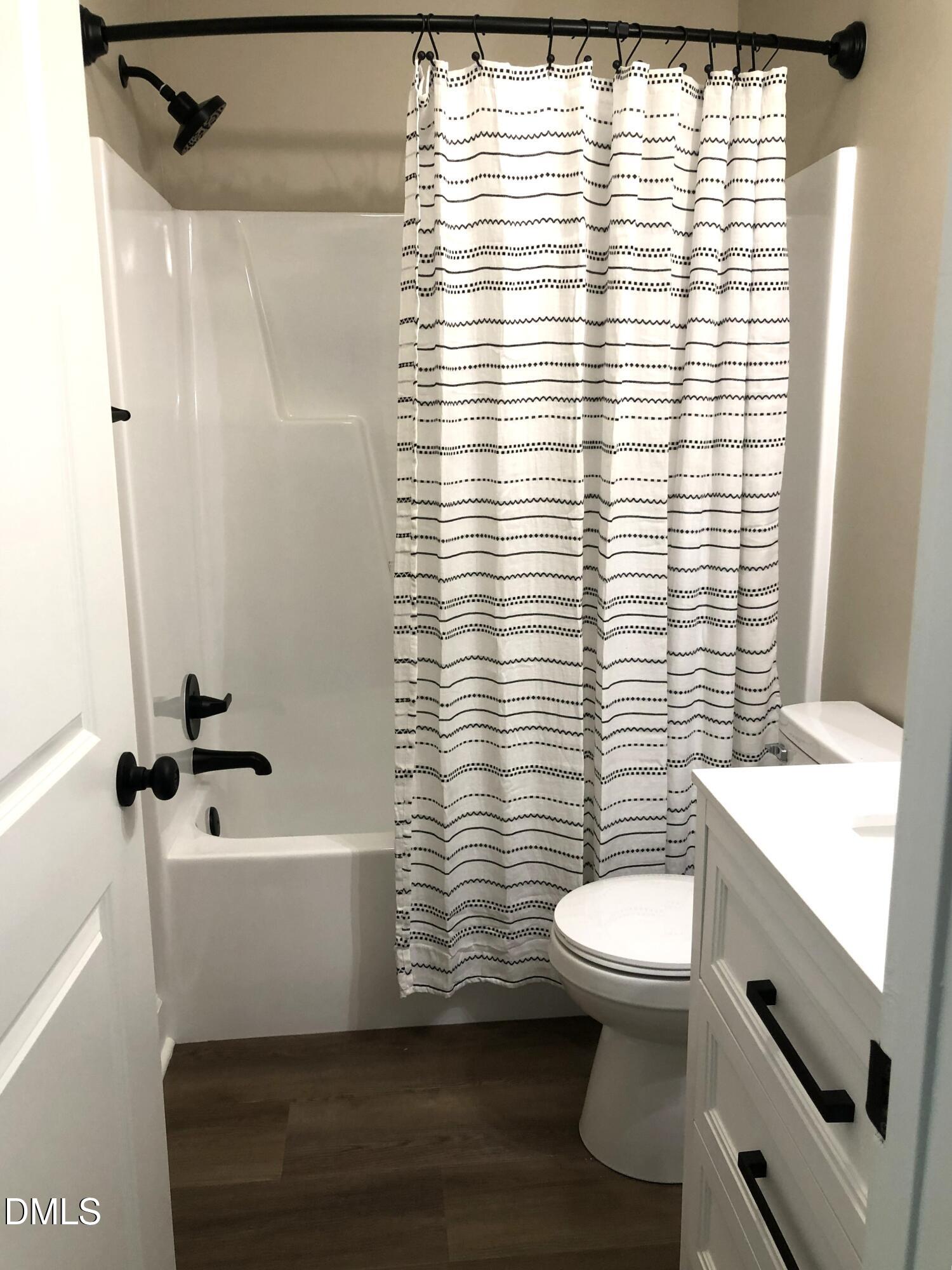 95 Smith Taylor Trail Roxboro, NC 27574 - Photo 36 of 47 a bathroom with a sink a toilet a window and shower