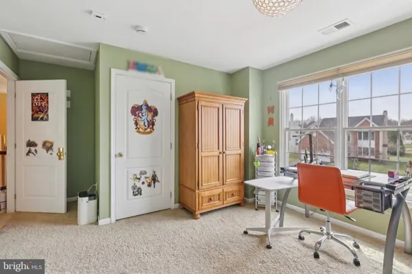 a view of a livingroom with furniture and a window