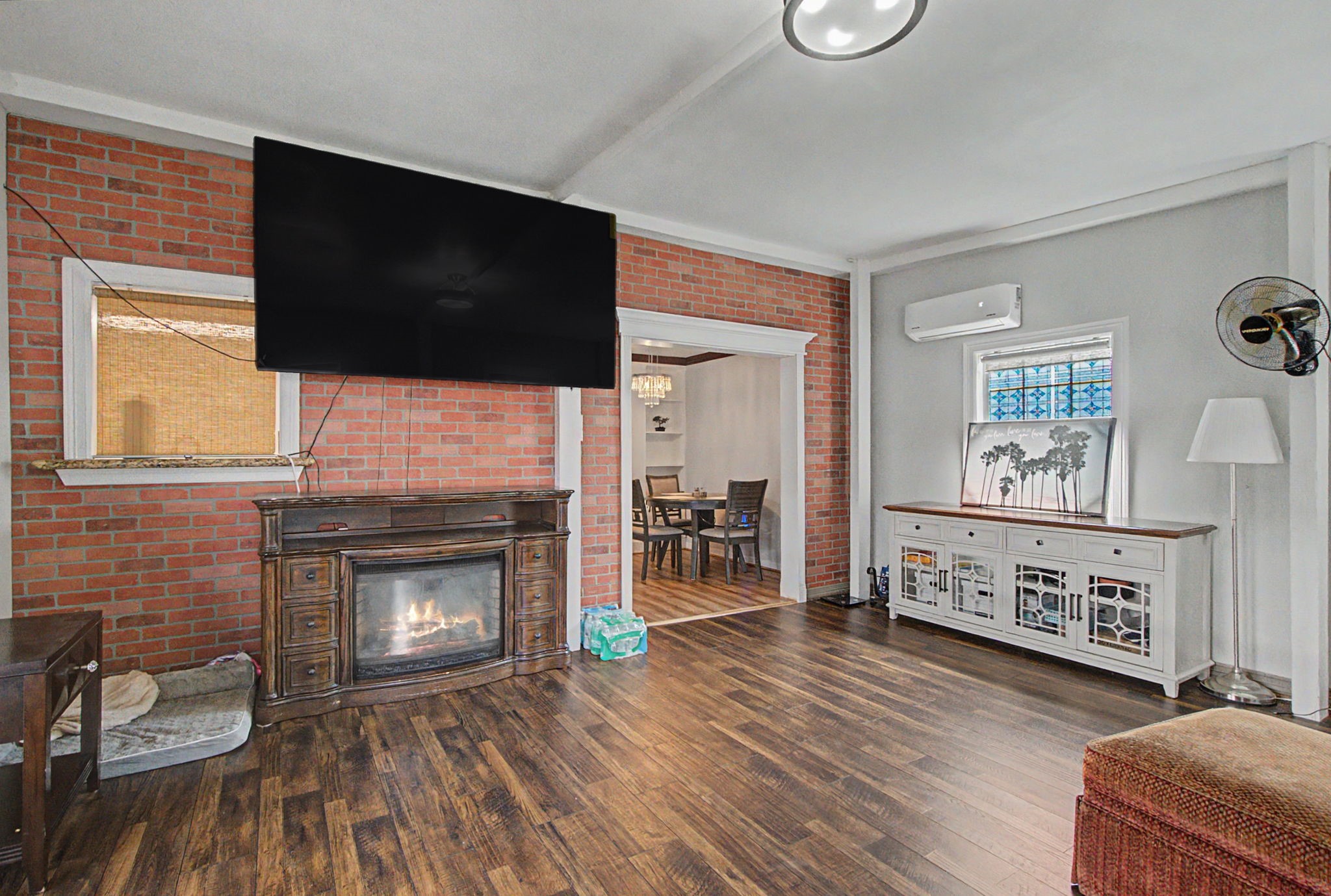 10034 Alfred Lane Houston, TX 77041 - Photo 25 of 50 Classic brick accents and a cozy fireplace create a warm focal point that makes this home truly feel special.