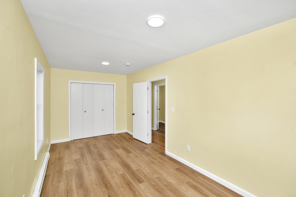 11 Greendale Road, Unit 2 Boston, MA 02126 - Photo 13 of 25 a view of hallway with wooden floor