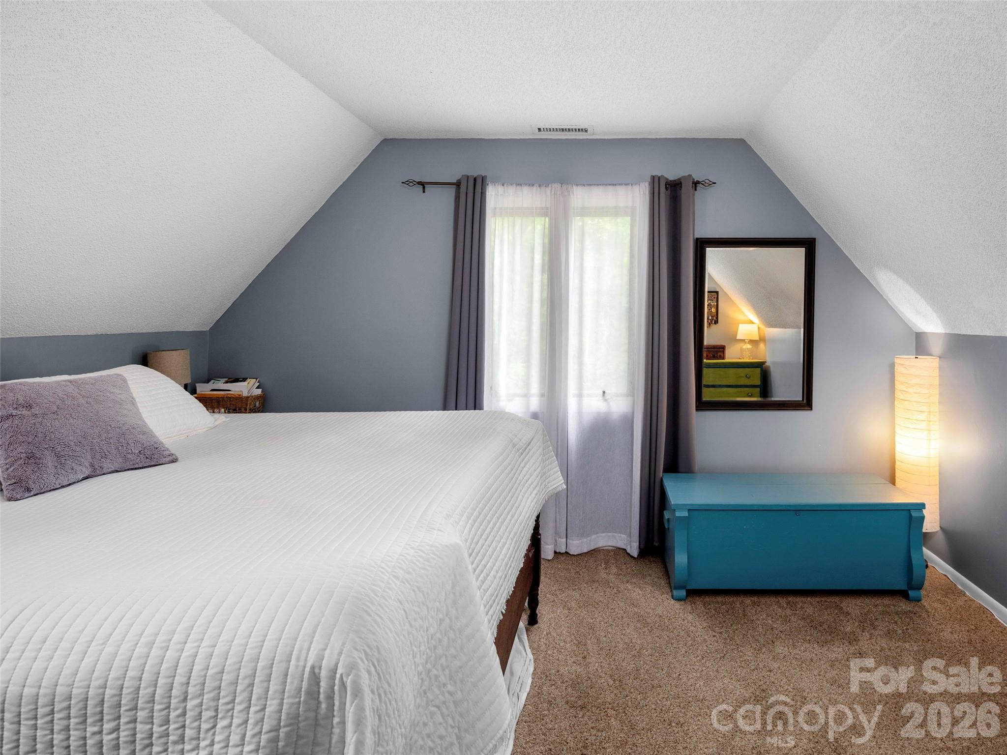 756 Pole Creasman Road Asheville, NC 28806 - Photo 20 of 29 a bedroom with a bed and window