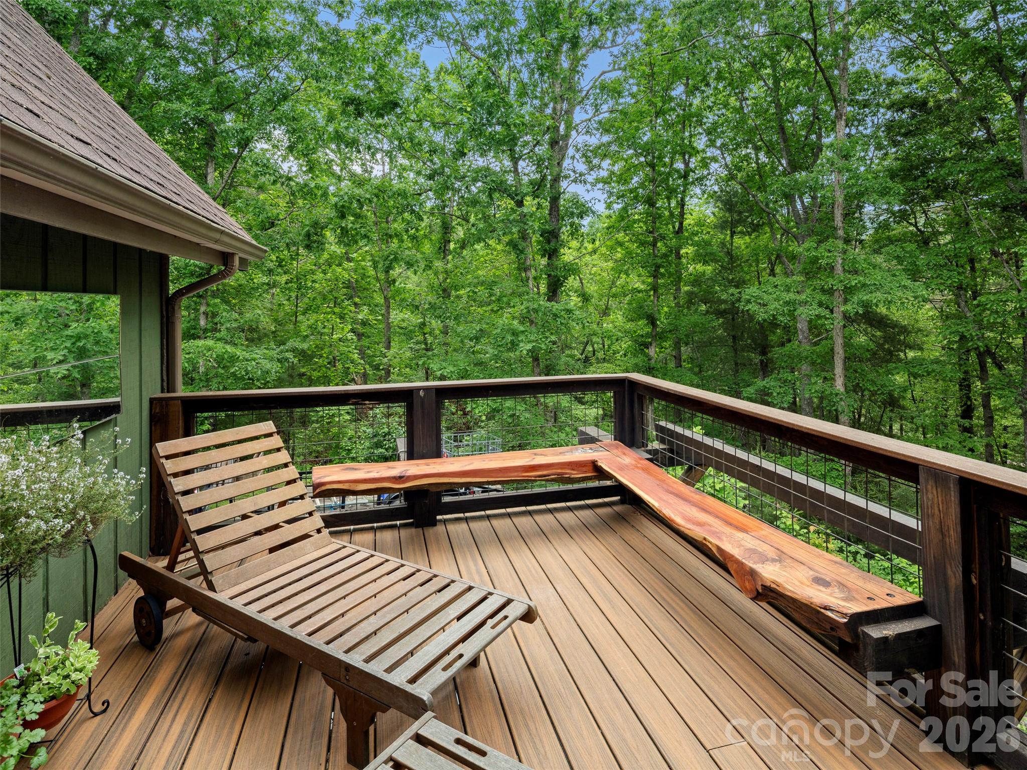 756 Pole Creasman Road Asheville, NC 28806 - Photo 21 of 29 a view of balcony with wooden floor and outdoor seating