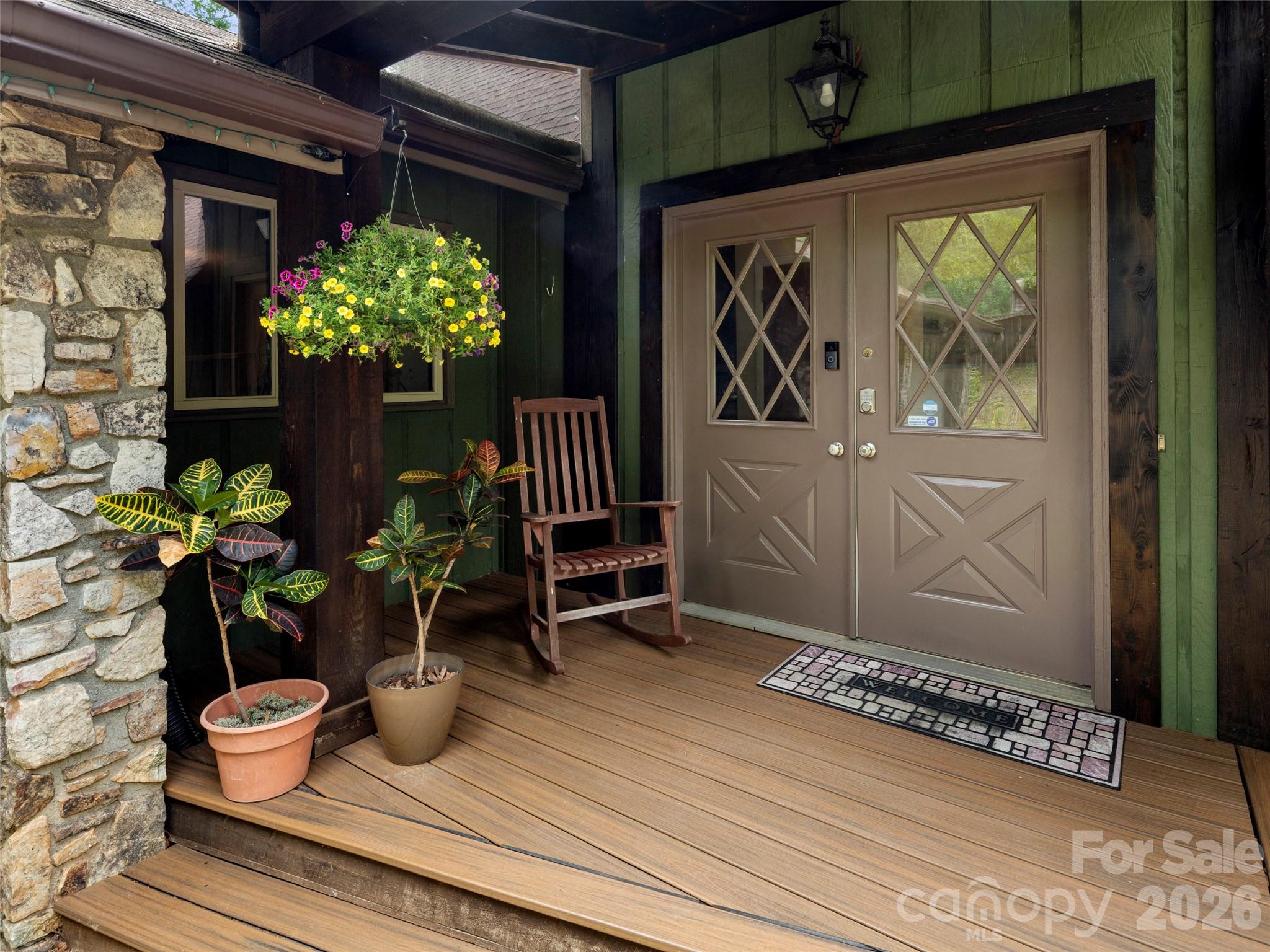 756 Pole Creasman Road Asheville, NC 28806 - Photo 3 of 29 a potted plant sitting in front of a door