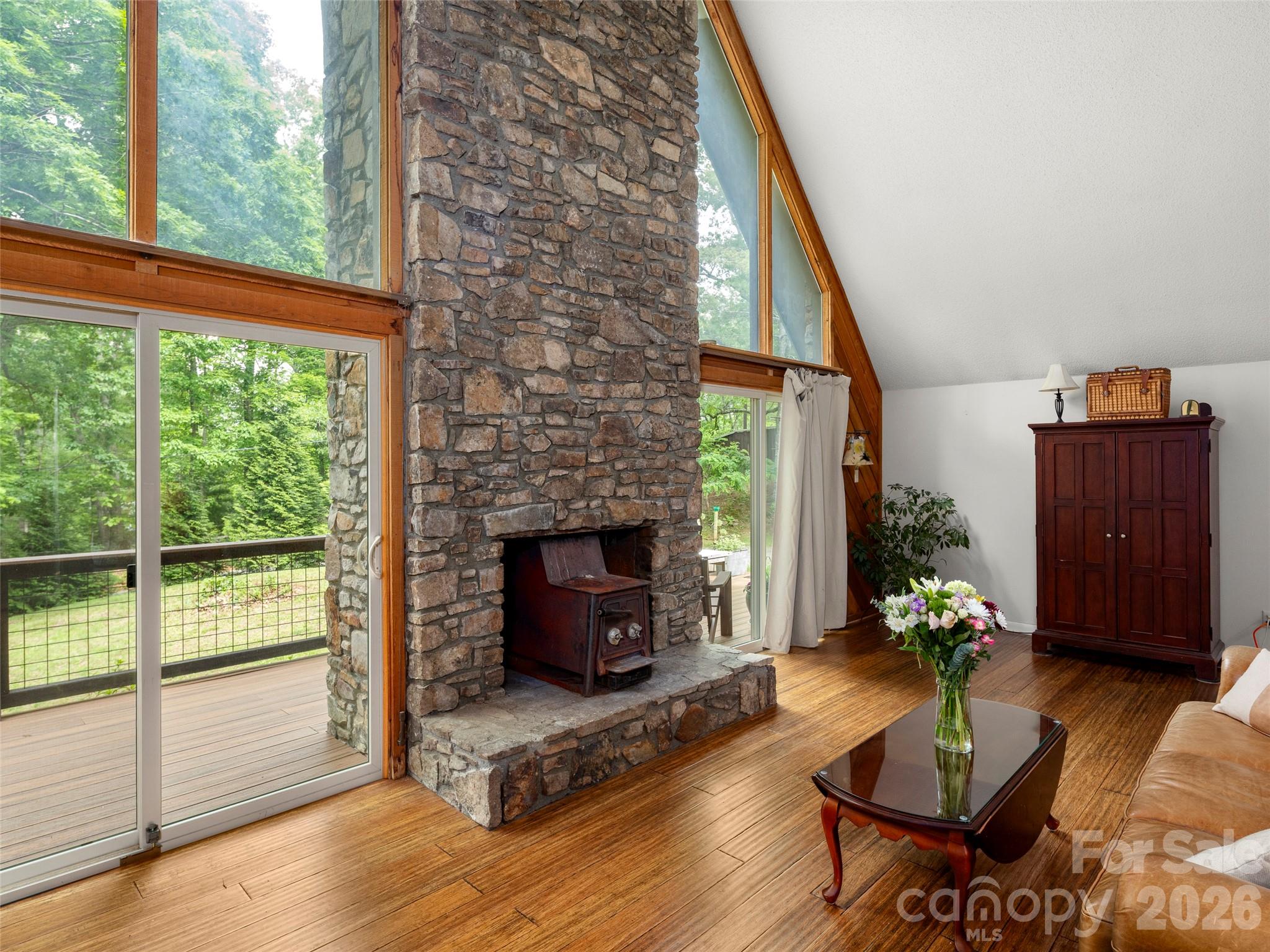756 Pole Creasman Road Asheville, NC 28806 - Photo 7 of 29 a living room with furniture and a fireplace
