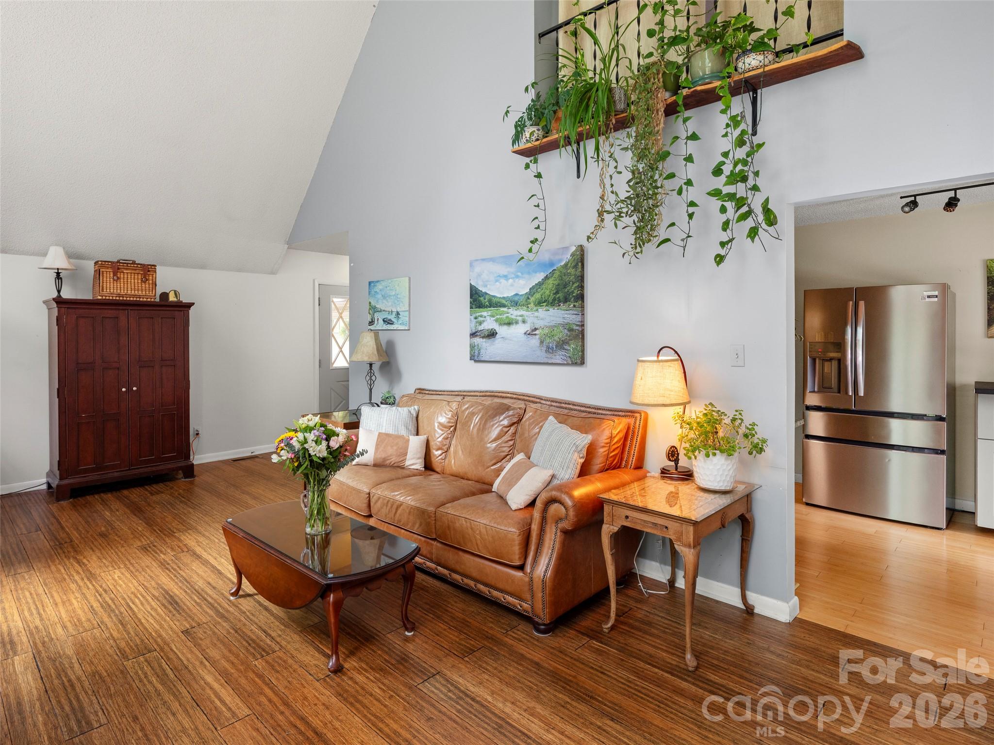 756 Pole Creasman Road Asheville, NC 28806 - Photo 8 of 29 a living room with furniture and a potted plant