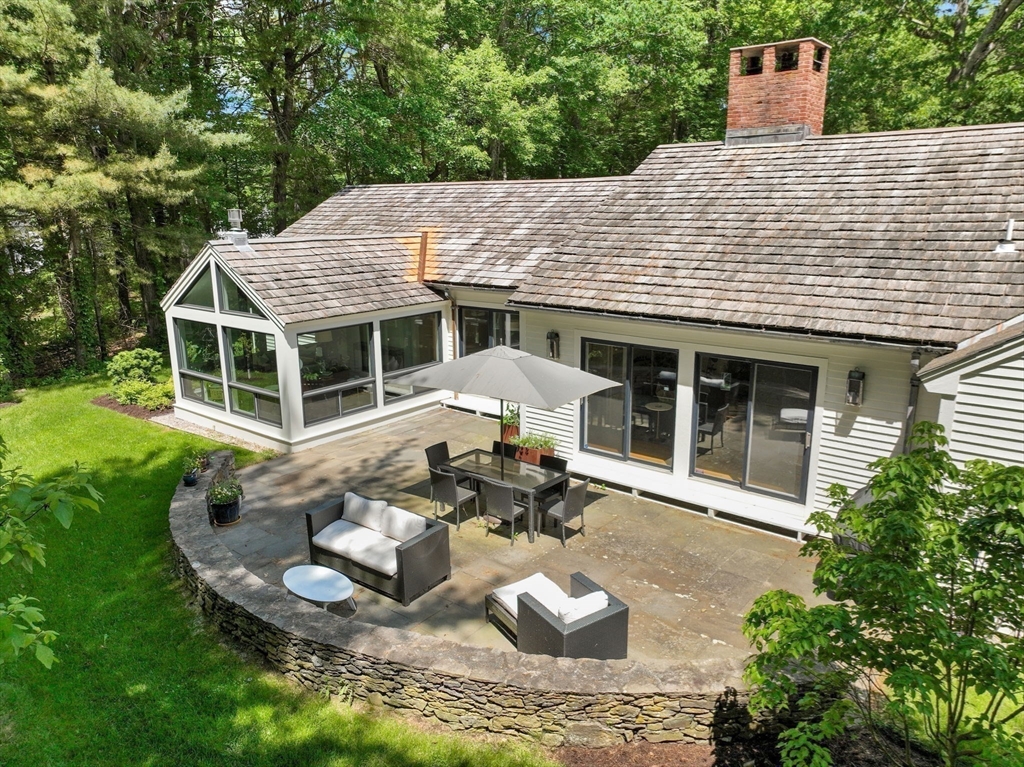 15 Ridge Hill Farm Road Wellesley, MA 02482 - Photo 5 of 38 a view of a house with a yard and sitting area