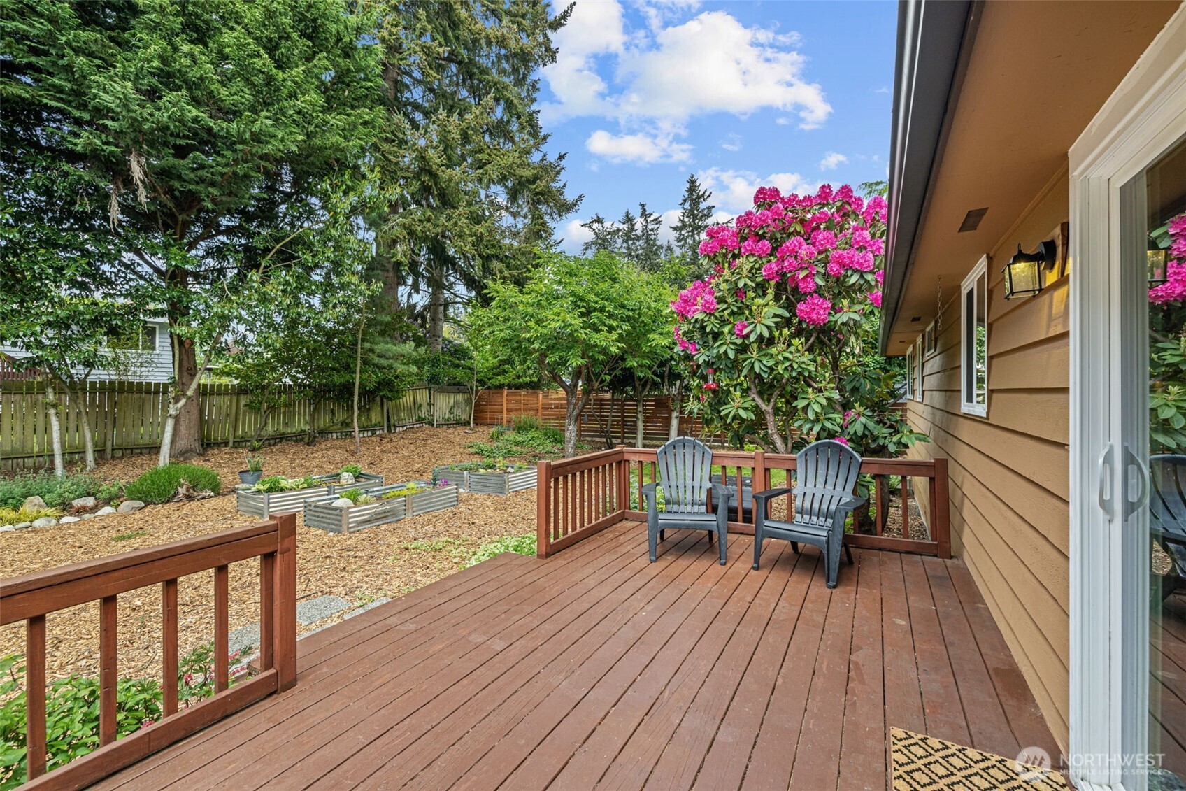 8629 223rd Street Southwest Edmonds, WA 98026 - Photo 29 of 40 a view of a balcony with chairs and wooden floor