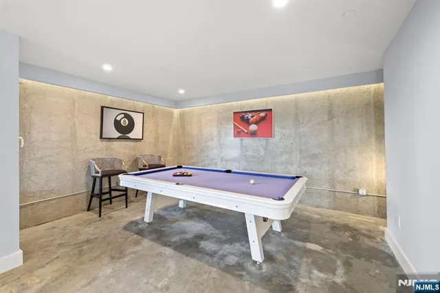 a view of a room with gym equipment and a large window