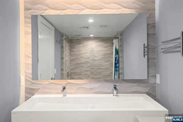 a living room with furniture wooden floor and a fireplace