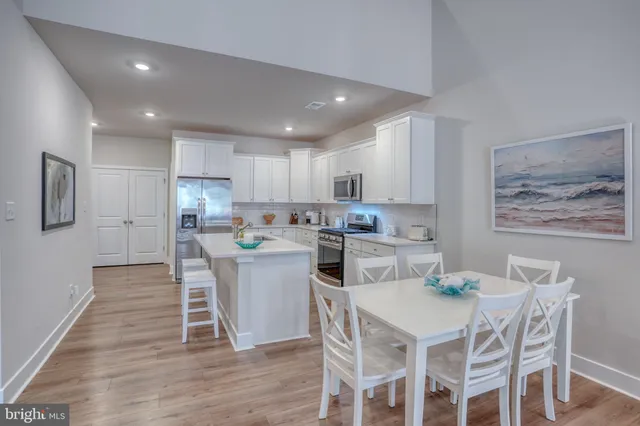 a view of living room with furniture and wooden floor