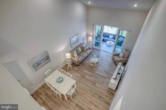 a living room with furniture or couch and a wooden floor