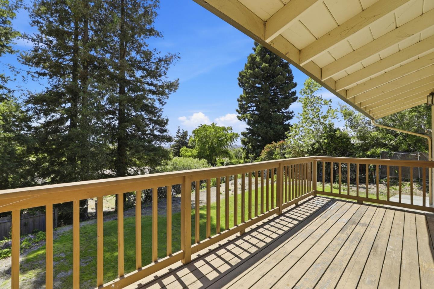 208 Mill Creek Road Fremont, CA 94539 - Photo 34 of 59 a balcony with wooden floor and fence